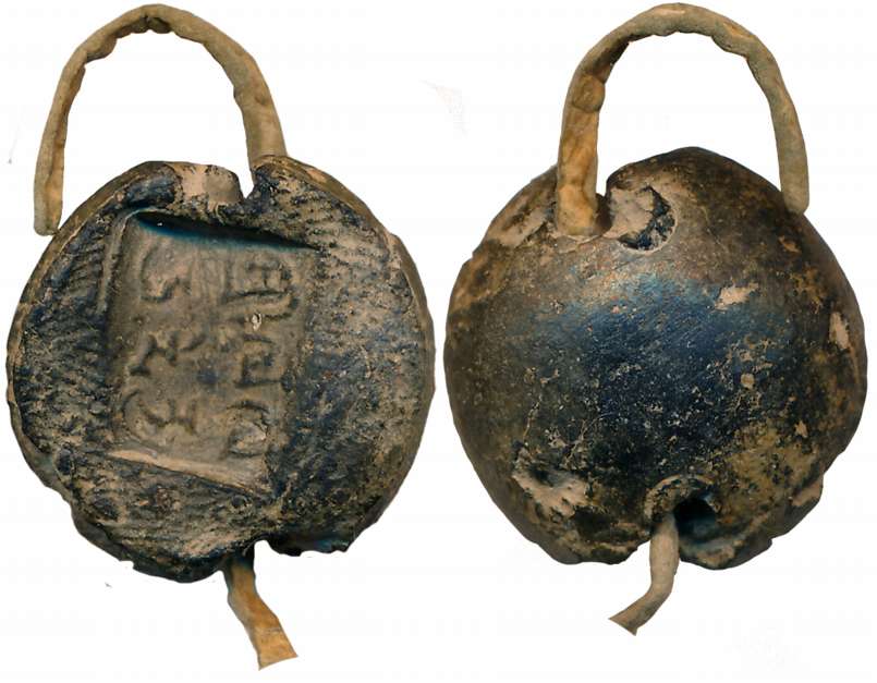 Ancient Terracotta sealing, on a piece of leather string, 5.13g, Brahmi legend of 5th-6th 