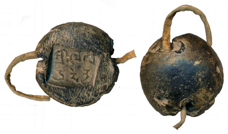 Ancient Terracotta sealing, on a piece of leather string, 5.13g, Brahmi legend of 5th-6th 